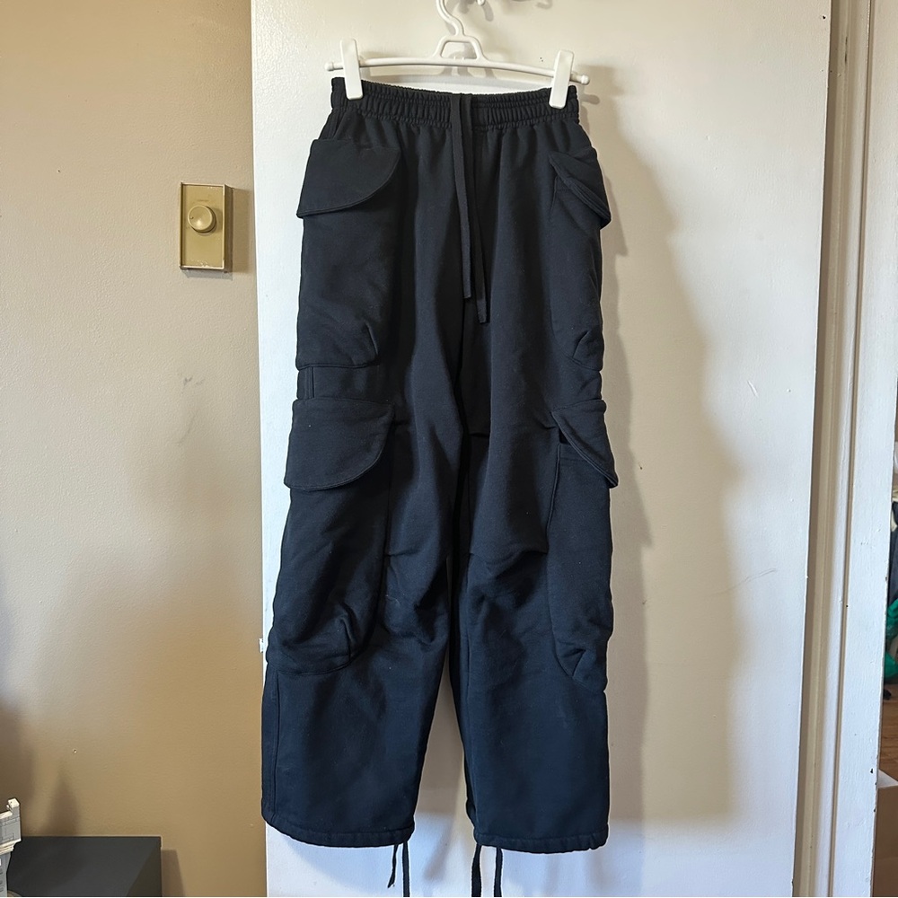 Black cargo sweatpants with drawstring waist and multiple pockets
